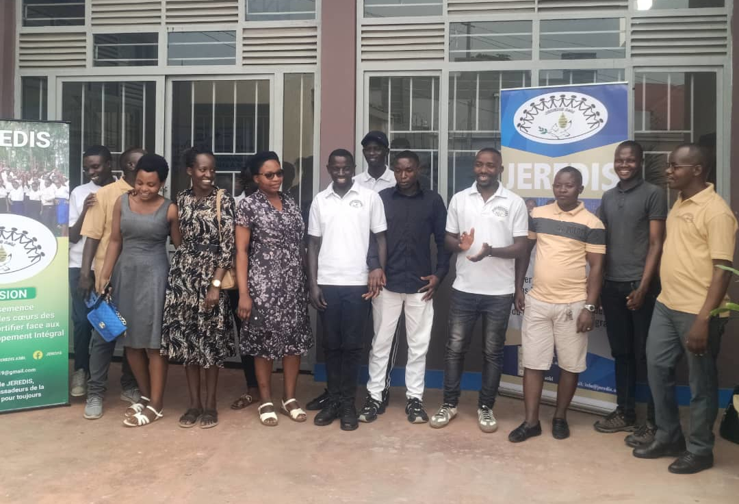 Youth volunteers cleaning up a community space